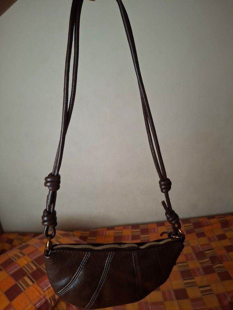 Dumpling bag croissant bag (Category: Luxury Bags & Wallets) located in Cebu City. Submitted by shielamarie_8 (Listing ID 1392577079, Image 1). Description: pu leather brand new mini bag dark brown color.