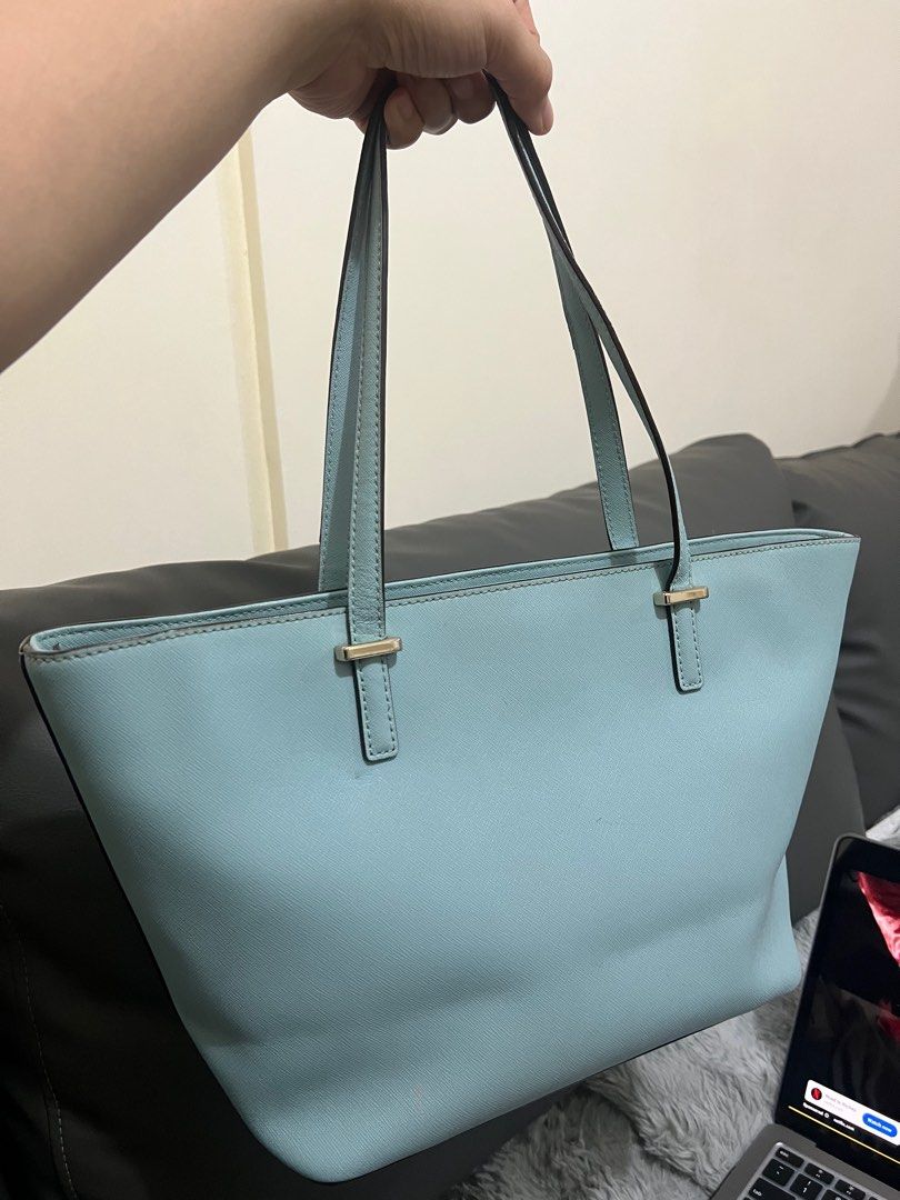 Kate spade Bag (Category: Luxury Bags & Wallets) located in Pasig City. Submitted by loysterr (Listing ID 1392575498, Image 2). Description: Original Kate Spade Tote Bag Light blue powder in color, Beige interior, Zipper and two inner pockets, Few slight imperfections as noted in photos Shoulder Strap Drop: 9.25" Height: 9.75" Width: 17.5" Depth: 6.25" payment via bank transfer first to pay will get the item sf c/o the buyer mod via lalamove/lbc 