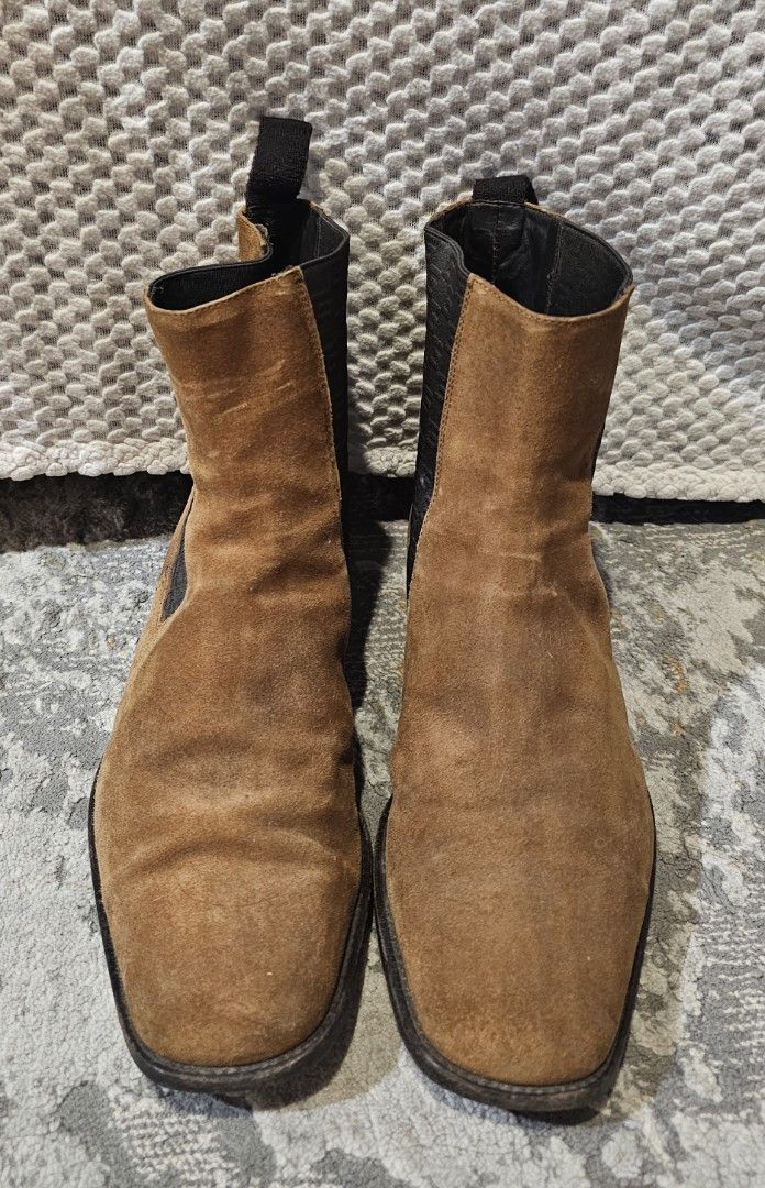 Men's Gucci Chelsea Boots (Category: Boots) located in Quezon City. Submitted by ricac. (Listing ID 1392572518, Image 3). Description: Step up your style with these authentic Gucci Chelsea Boots, crafted in rich brown suede with black elastic side panels featuring the subtle GG logo weave. Made in Italy, these boots embody Gucci’s signature blend of luxury and timeless design..
