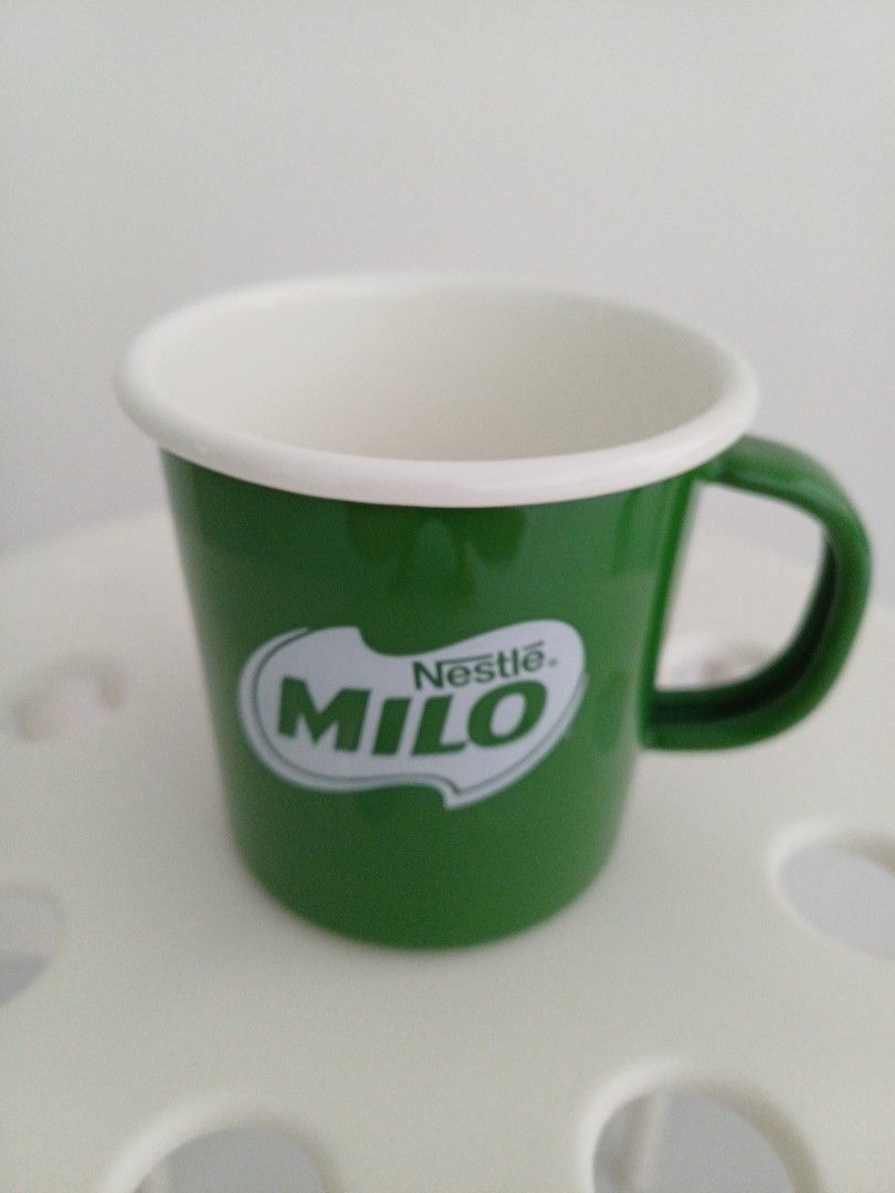 Nestle Milo Mug - Green (Category: Coffee & Tea Tableware) located in Singapore. Submitted by cdawh (Listing ID 1392550359, Image 1). Description: - Nestle Milo mug - Green exterior - White interior - Approximately 8cm in diameter and 9cm in height - Perfect for Milo - Free doorstep delivery for address within 15-minute walk from Canberra, Sembawang or Yishun MRT .