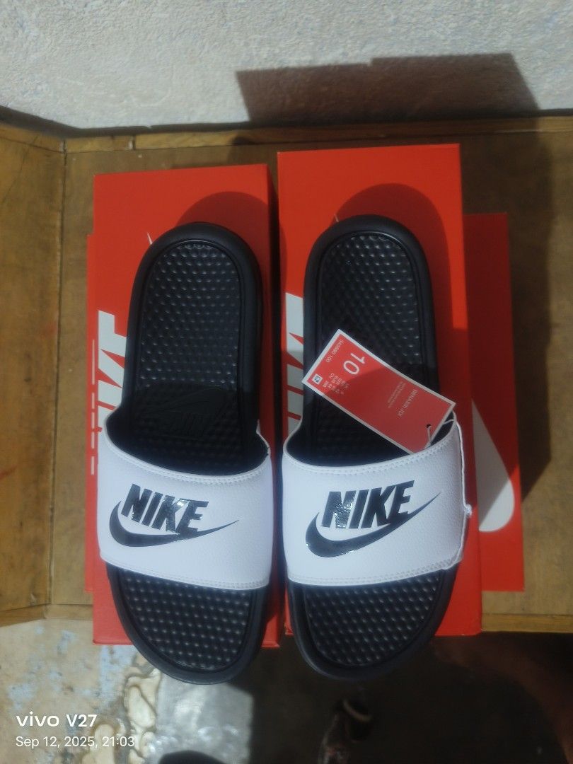 Nike benassi (Category: Slippers & Slides) located in Manila. Submitted by basiclang (Listing ID 1392619579, Image 1). Description: Nike benassi white black size 8 -4 size 9 -3 size 10- 3 below srp 1095 legit.