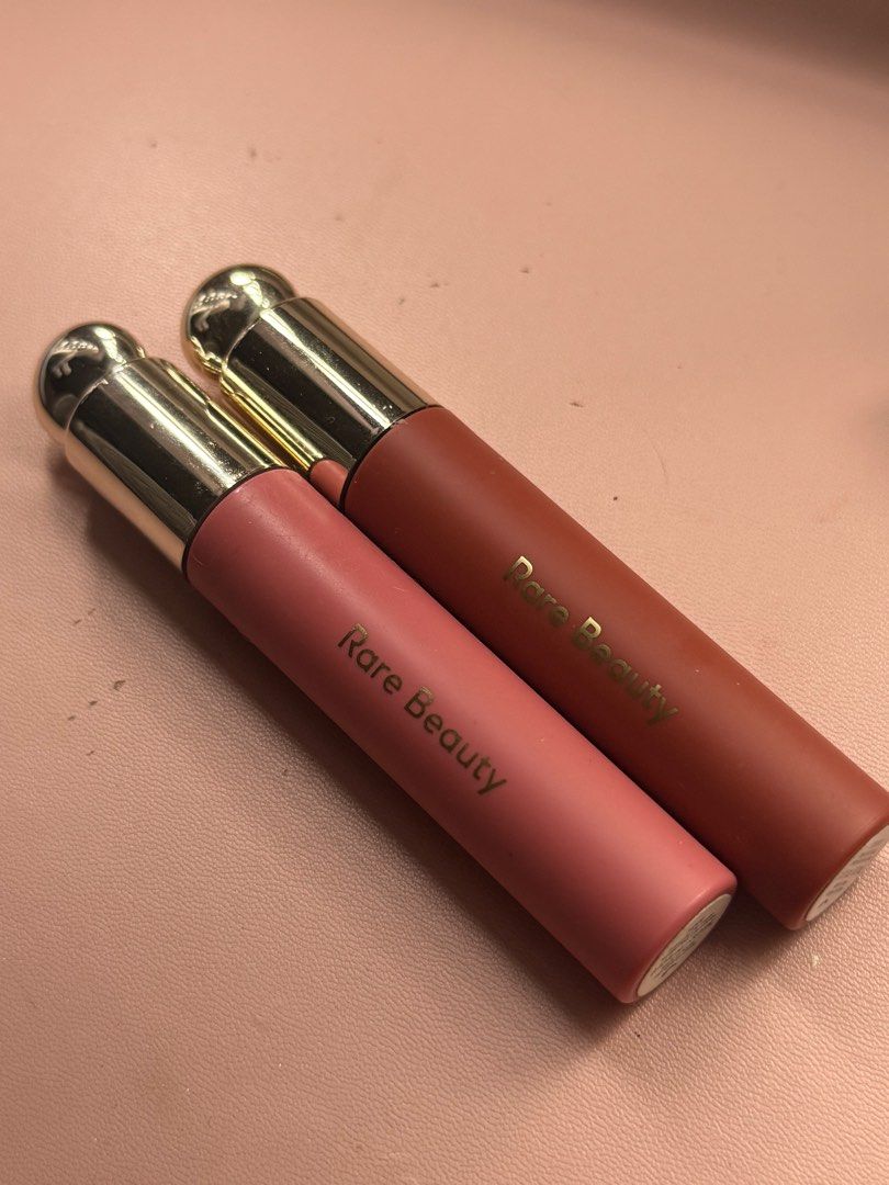 TAKE BOTH Rare Beauty Lip Oils (Category: Makeup) located in Makati City. Submitted by saymynameeee (Listing ID 1392660957, Image 1). Description: Shades: Hope & Serenity Abt 80% ~ full no longer using these Take both for 990! Both bought in Sephora Via grab or lalamove only Loc: east rembo taguig.
