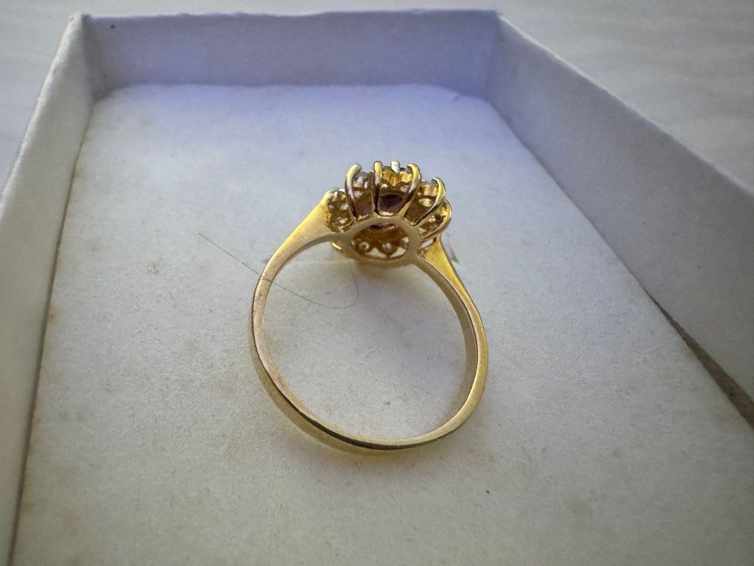 Ruby cluster ring (Category: Rings) located in Ipoh. Submitted by luckydog.1982 (Listing ID 1392601850, Image 2). Description: Cluster rings have been popular for centuries, with variations appearing throughout different eras. The halo design, where smaller stones surround a larger center stone, gained prominence in the Victorian era and has remained a classic choice. These rings often symbolize love, commitment, and elegance. Ruby is a gemstone 