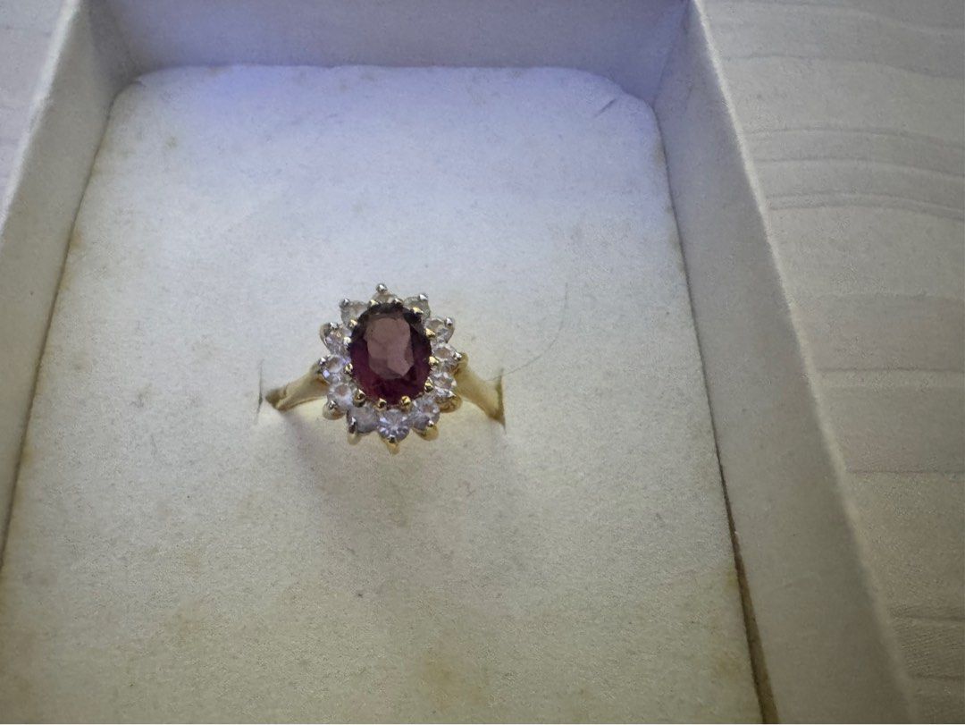 Ruby cluster ring (Category: Rings) located in Ipoh. Submitted by luckydog.1982 (Listing ID 1392601850, Image 1). Description: Cluster rings have been popular for centuries, with variations appearing throughout different eras. The halo design, where smaller stones surround a larger center stone, gained prominence in the Victorian era and has remained a classic choice. These rings often symbolize love, commitment, and elegance. Ruby is a gemstone 