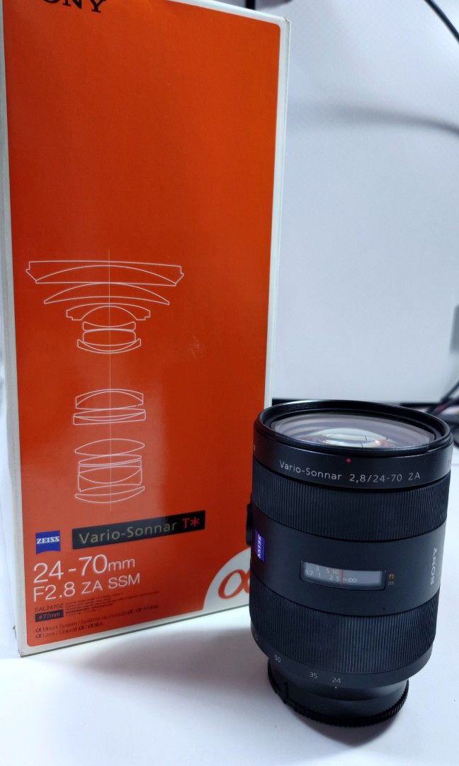 Sony Lens A-Mount 24-70mm (Category: Lens & Kits) located in Makati City. Submitted by ppomidyar (Listing ID 1392583325, Image 3). Description: F2.8 ZA SSM Zeiss Vario Sonnar T. with lens hood and box.