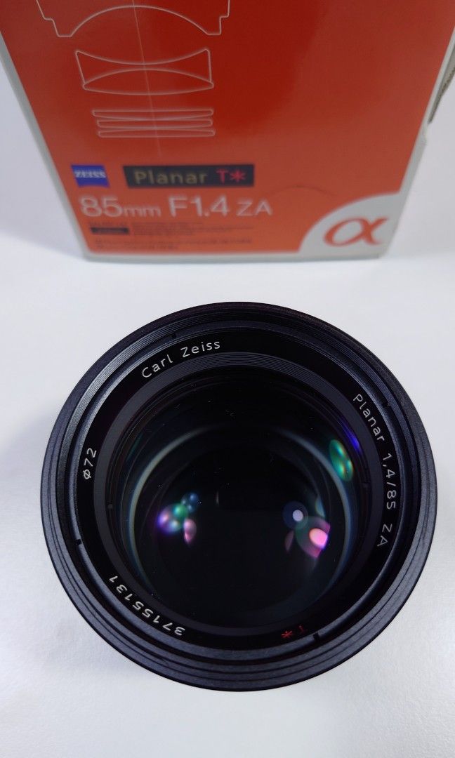 Sony Lens A-Mount 85mm (Category: Lens & Kits) located in Makati City. Submitted by ppomidyar (Listing ID 1392584897, Image 1). Description: F1.4 ZA SAL-85F14Z Zeiss Planna T* Portrait. with lens hood and box..