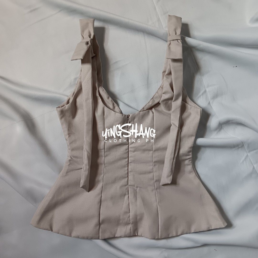 BSCO Celeste Light Pale Bow Sleeveless Deep V-neck Top (Category: Sleeveless) located in Mandaluyong City. Submitted by yingshangclothingph (Listing ID 1392836829, Image 3). Description: CELESTE TOP Size: XS Bust: 32in Waist: 25in Length: 19in Fabric: Fine Cotton (non-stretch) Details: Double Lining, Back Zipper, Deep V-neck, Sleeveless Color: Light Pale *product color may vary due to lighting or your monitor settings. please manage your expectat