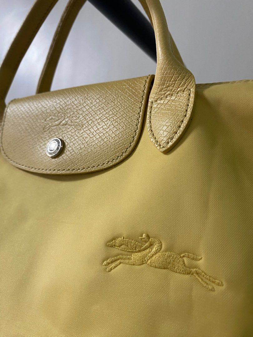 MUST GO!!! Longchamp Le Pliage Green Small (Category: Luxury Bags & Wallets) located in Davao. Submitted by kendi_shoppe (Listing ID 1392776284, Image 2). Description: In excellent used condition Size: Small Color: Wheat (Pastel yellow) No inclusions hence selling low First to pay basis. Payment Options: - GCash - BDO - BPI Shipping via J&T only.