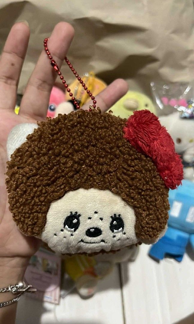 Monchichi x Hello kitty Face plush pouch wallet keychain (Category: Plushies & Soft Toys) located in Cebu City. Submitted by vionchan (Listing ID 1392758934, Image 1). Description: no issues rare sekiguchi brand.