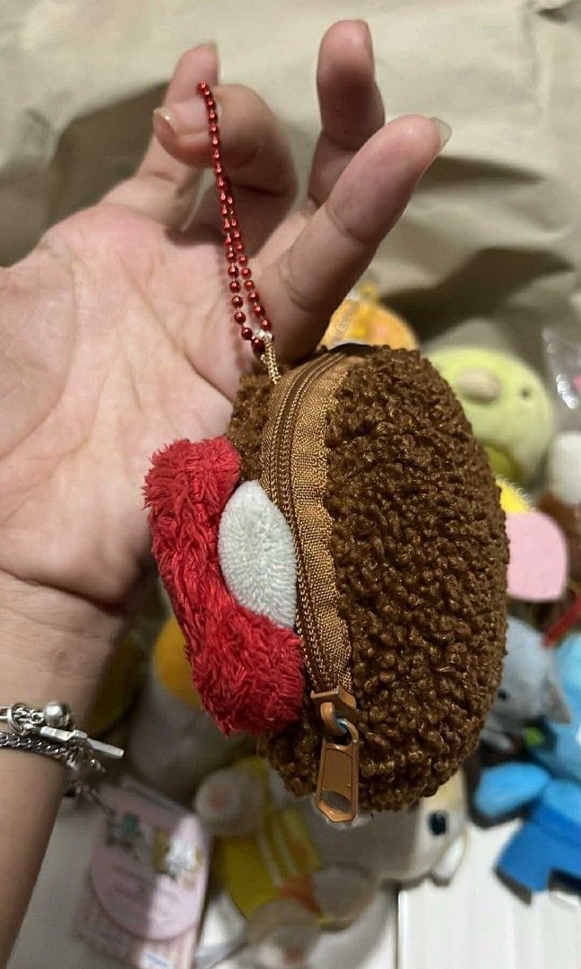 Monchichi x Hello kitty Face plush pouch wallet keychain (Category: Plushies & Soft Toys) located in Cebu City. Submitted by vionchan (Listing ID 1392758934, Image 2). Description: no issues rare sekiguchi brand.