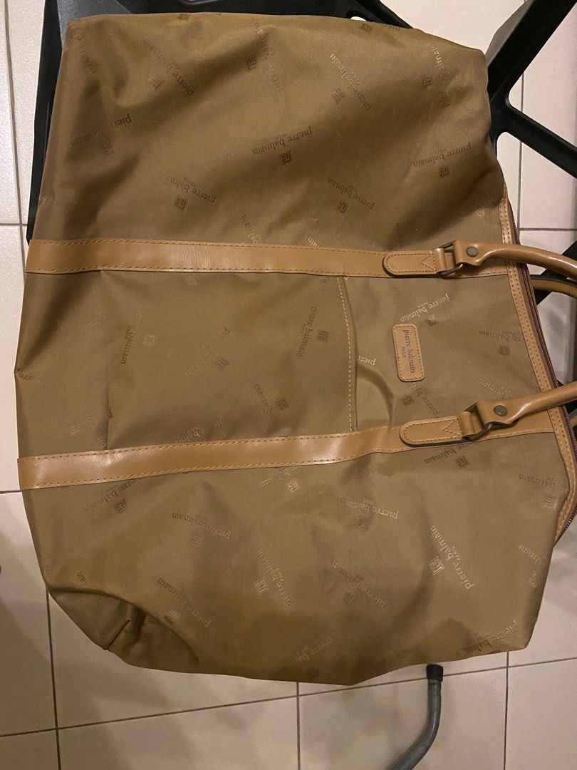 PIERRE BALMAIN Vintage handbag (Category: Luxury Bags & Wallets) located in Makati City. Submitted by celebrityauctions (Listing ID 1386570621, Image 1). Description: Original pierre balmain weekender duffle bag. Please see pics for size. IT LOOKS LIKE ITS BEEN ONLY USED A FEW TIMES. VERY NEAT AND CLEAN. Elevate your travel style with this authentic Pierre Balmain duffle bag, perfect for weekend getaways or daily essentials. This spacious and sty