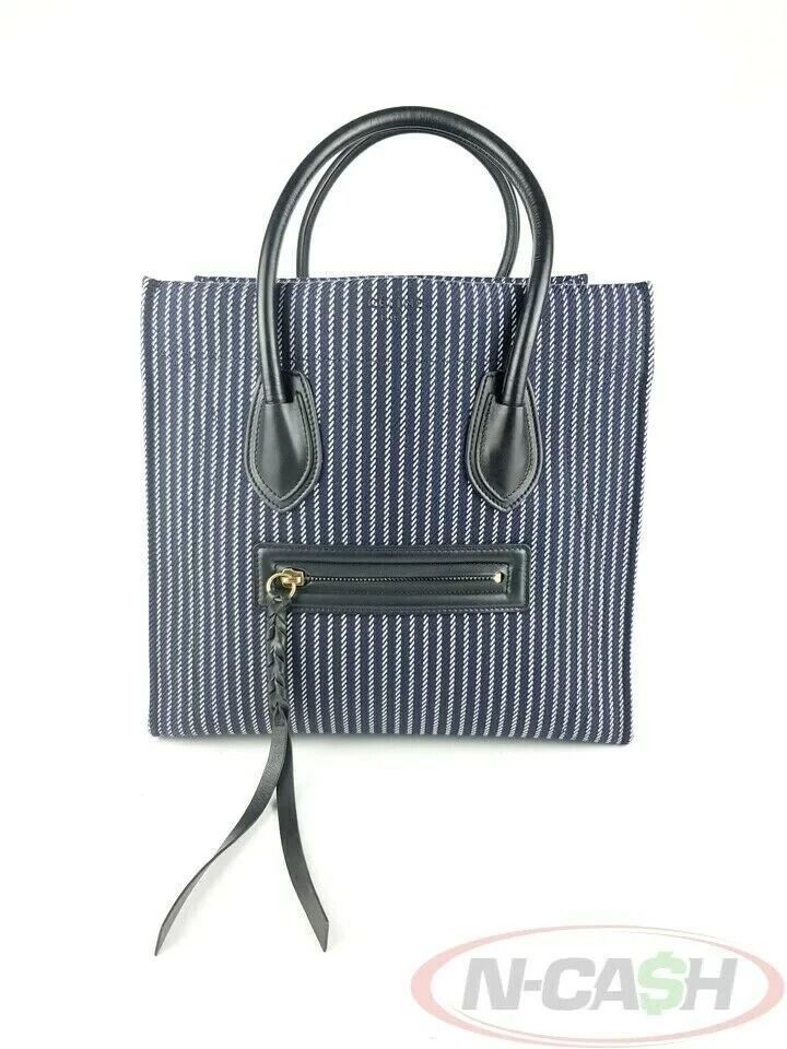 Celine Striped Navy White Medium Phantom Luggage Bag (Category: Luxury Bags & Wallets) located in Quezon City. Submitted by luxury_by_n-cash (Listing ID 1392957844, Image 1). Description: N-Cash Pawnshop "Instant Cash for Bags, Watches, Cars, and Electronics" https://www.ncash-pawnshop-philippines.com/ Celine Striped Navy White Medium Phantom Luggage Bag Measures: 11.75″ L (at base), 22.5″ (at wings) x 11″ H x 10″ D (approx) 5″ Handle Drop Materi