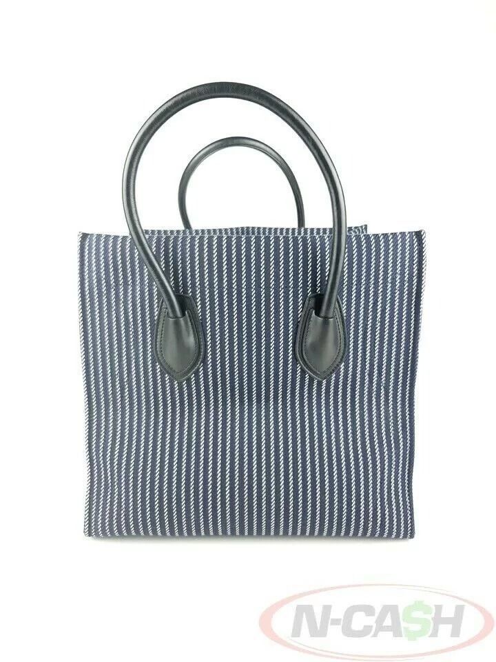 Celine Striped Navy White Medium Phantom Luggage Bag (Category: Luxury Bags & Wallets) located in Quezon City. Submitted by luxury_by_n-cash (Listing ID 1392957844, Image 2). Description: N-Cash Pawnshop "Instant Cash for Bags, Watches, Cars, and Electronics" https://www.ncash-pawnshop-philippines.com/ Celine Striped Navy White Medium Phantom Luggage Bag Measures: 11.75″ L (at base), 22.5″ (at wings) x 11″ H x 10″ D (approx) 5″ Handle Drop Materi