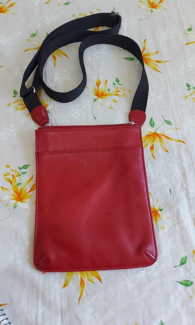 COACH red leather crossbody slingbag small (Category: Luxury Bags & Wallets) located in Baguio. Submitted by blossombeauty.chicfinds23 (Listing ID 1393028028, Image 1). Description: Very good condition Plus shipping Kasya cp Authentic.