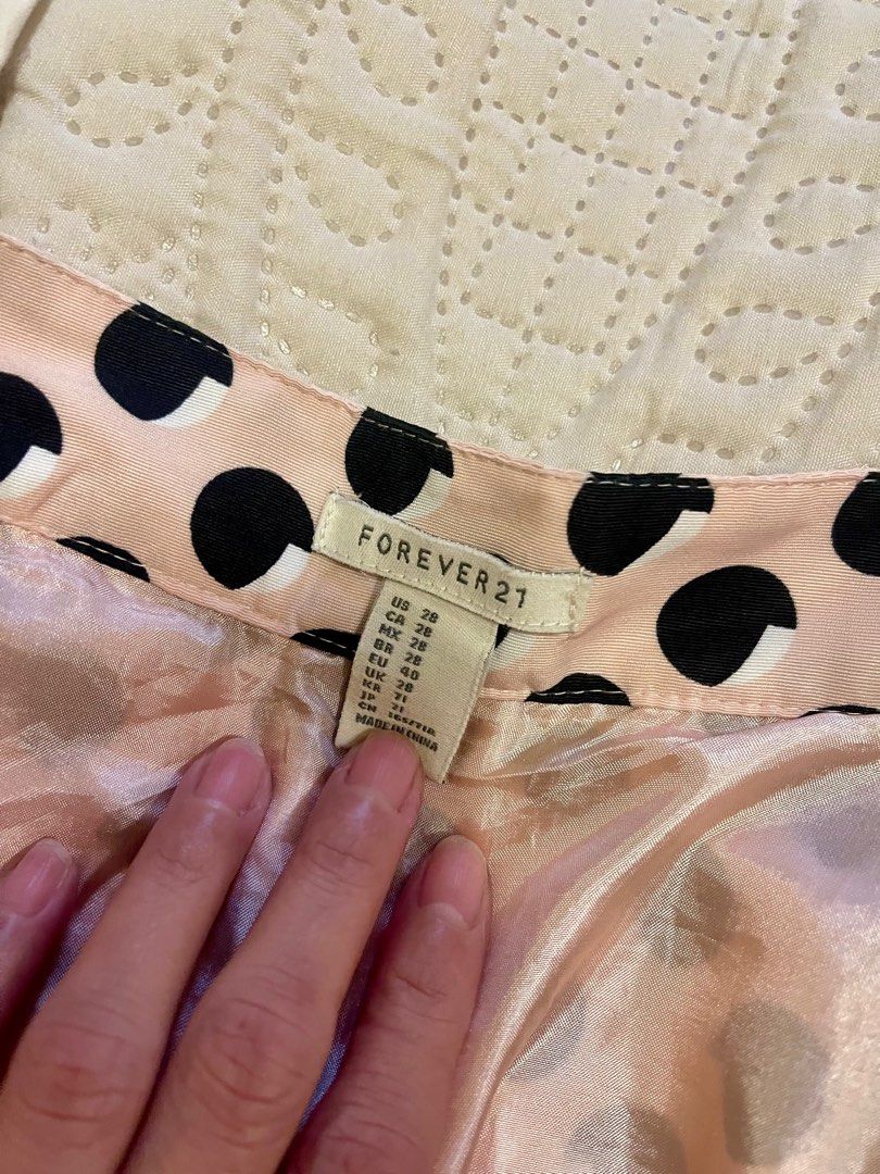 Forever 21 Skater Skirt (Category: Skirts) located in Makati City. Submitted by daysoftheriver1122 (Listing ID 1392928565, Image 3). Description: Wanna look sweet and demure — and a bit flirty? 🤭 This skirt is perfect then! 🌸 🌈 Color: Baby Pink with Black Polka Dots 📏 Size: Waist 28” | Length 14” .