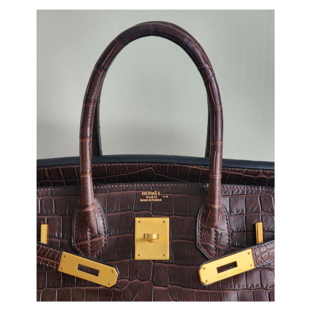 Hermes Birkin 30 Croc Havana (Category: Luxury Bags & Wallets) located in Manila. Submitted by luxe88nhelmueller (Listing ID 1392924212, Image 3). Description: Available on hand Pre owned In good condition 🔥 Hermes 🔥 Birkin 30 Havane Matte Niloticus Crocodile Matte Gold Hardware Toile Canvas Interior Stamp G Year 2003 Comes with Clochette, Lock, keys, Dustbag, Raincoat And box.