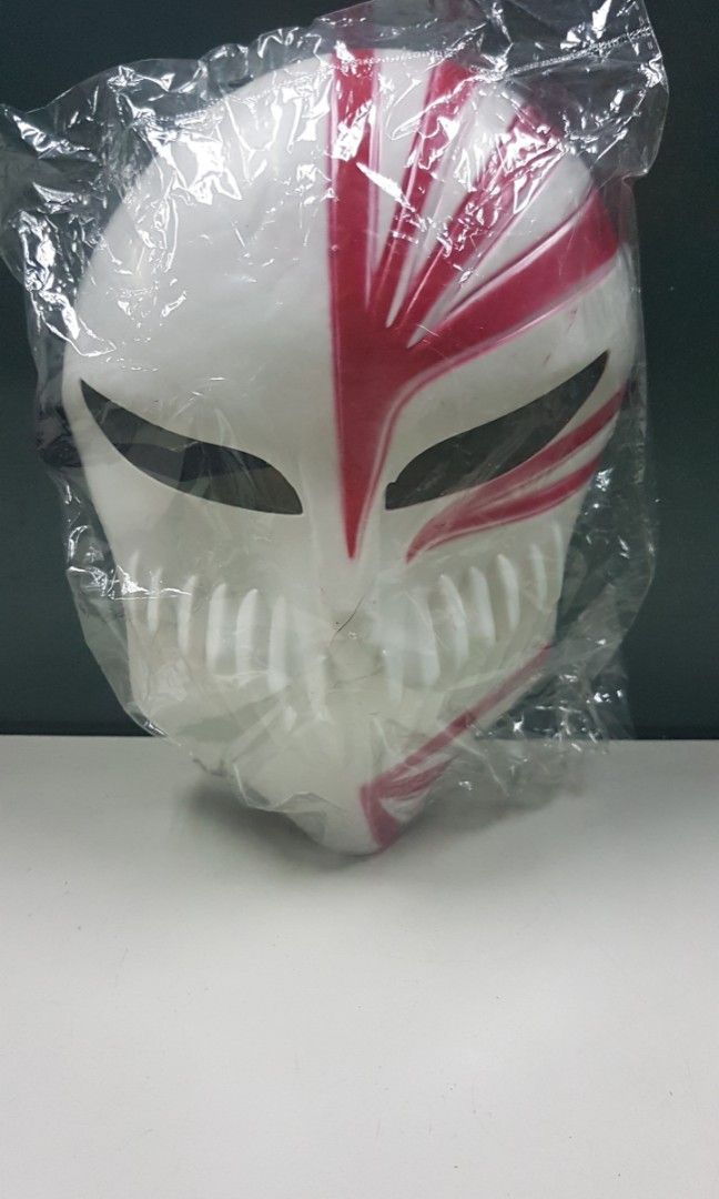 Ichigo Facemask Anime Costume Cosplay (Category: Figurines & Statues) located in Quezon City. Submitted by whizdepot (Listing ID 1392888443, Image 1). Description: This image shows a replica of Ichigo Kurosaki's Hollow Mask from the anime series Bleach. This specific mask is associated with Ichigo's Hollowfication, a state where he gains Hollow powers. It's a popular item for cosplay and fans of the Bleach series. Similar masks are available for 