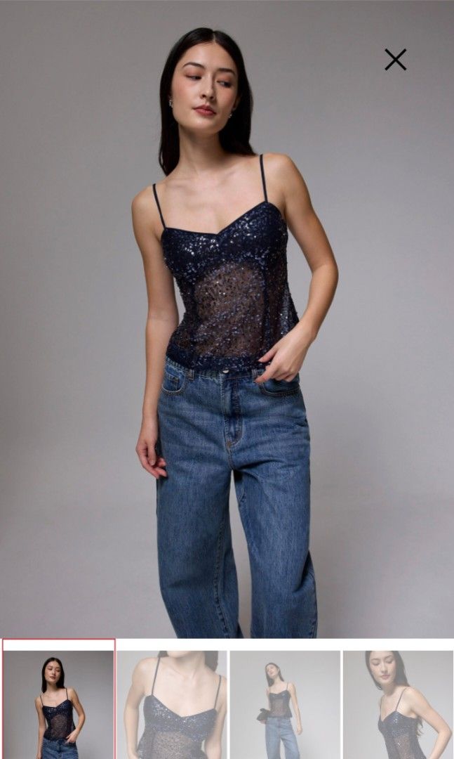 Love, Bonito Padded Sequin V-neck Bustier Top (Category: Sleeveless) located in Cebu City. Submitted by kateeedy (Listing ID 1392967250, Image 1). Description: Selling the Love, Bonito Padded Sequin V-neck Bustier Top in Dark Blue for Php. 1,200. I bought this for Php. 1,275. This is brand new with tags. Size: Medium, size guide attached in the pictures. RFS: Not my style.