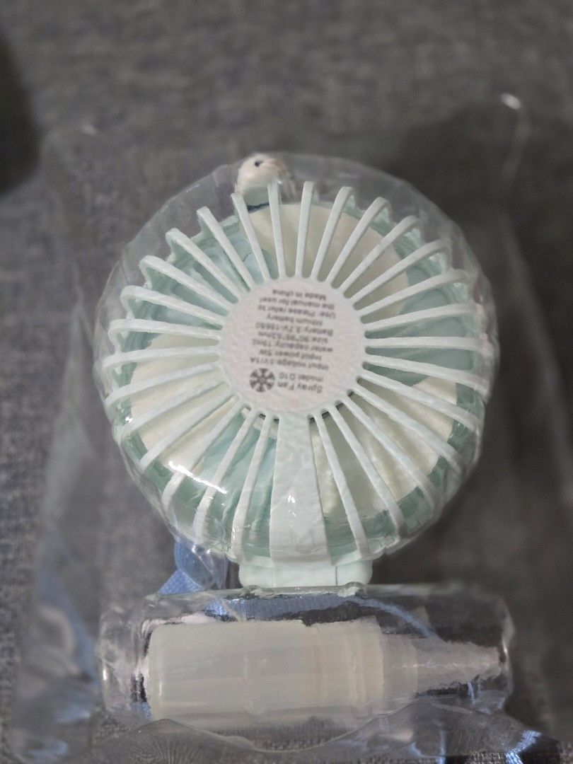 Multi-function Spray Fan (Category: Fans) located in Singapore. Submitted by koabear (Listing ID 1392990809, Image 3). Description: - New multi-function spray fan - 3-speed settings - USB rechargeable - Built-in 18650 lithium battery - Water spray function for extra cooling - Includes small refill bottle.