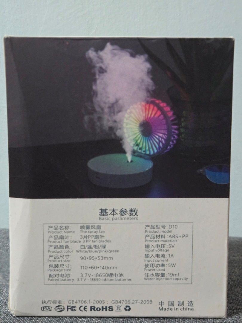 Multi-function Spray Fan (Category: Fans) located in Singapore. Submitted by koabear (Listing ID 1392990809, Image 2). Description: - New multi-function spray fan - 3-speed settings - USB rechargeable - Built-in 18650 lithium battery - Water spray function for extra cooling - Includes small refill bottle.