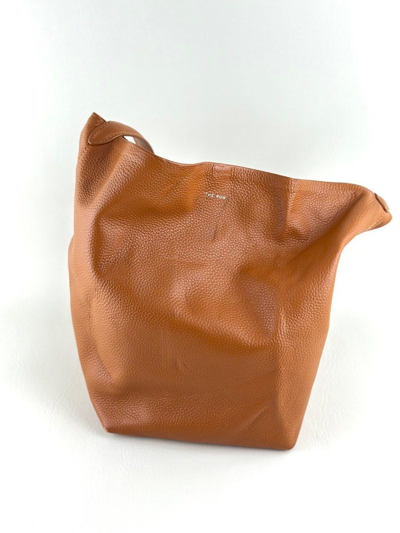 THE ROW N/S Park Tote (Category: Luxury Bags & Wallets) located in Manila. Submitted by luvluxe.mnl (Listing ID 1393054405, Image 2). Description: Authentic Medium size With minimal rubs on the lower corner but is unnoticeable when worn— over all in very good condition!! No functionality issue Rare color way.