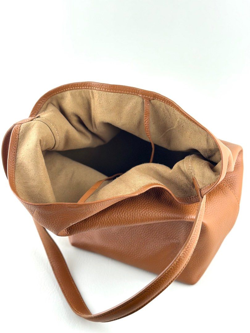 THE ROW N/S Park Tote (Category: Luxury Bags & Wallets) located in Manila. Submitted by luvluxe.mnl (Listing ID 1393054405, Image 3). Description: Authentic Medium size With minimal rubs on the lower corner but is unnoticeable when worn— over all in very good condition!! No functionality issue Rare color way.