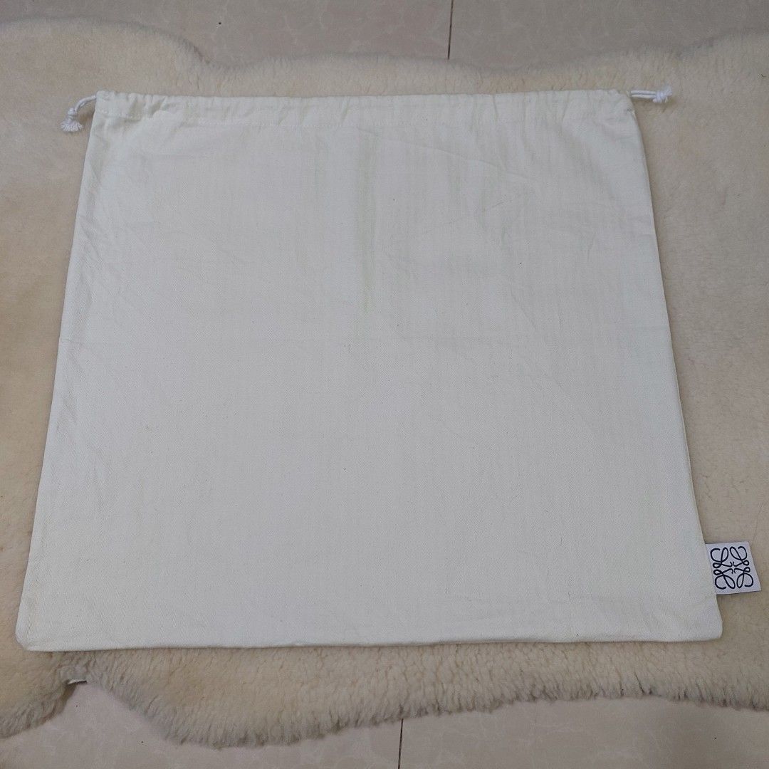 Authentic Loewe Dust bag 18.5x20 inches (Category: Luxury Bags & Wallets) located in Manila. Submitted by jfluxury.co (Listing ID 1393214843, Image 2). Description: excellent condition no flaws bought in Japan 🇯🇵 💯% Authentic. 😊 Money back guarantee. 😊 Clean and ready to use na.