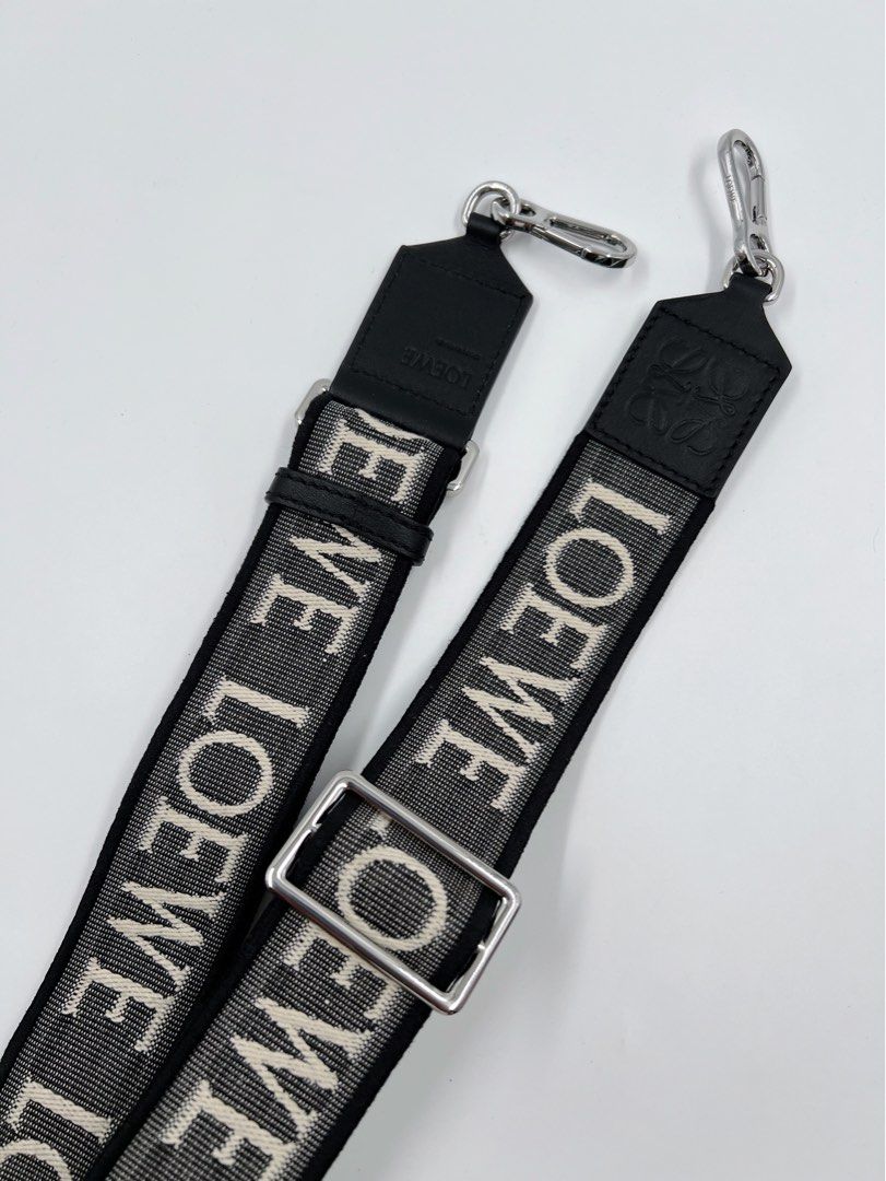 ⚜️Loewe Reversible Strap (Category: Luxury Accessories) located in Makati City. Submitted by 90sangel (Listing ID 1308214442, Image 3). Description: •Item: Loewe - White Anagram-jacquard Reversible Shoulder Strap 🖤 •Size: One size •Condition: Excellent! 💯 *W/ Adjustable fit carabiner attachments. This piece comes complete with a protective dust bag / paperbag. Material:calfskin/Fabric. 🖤🤍.