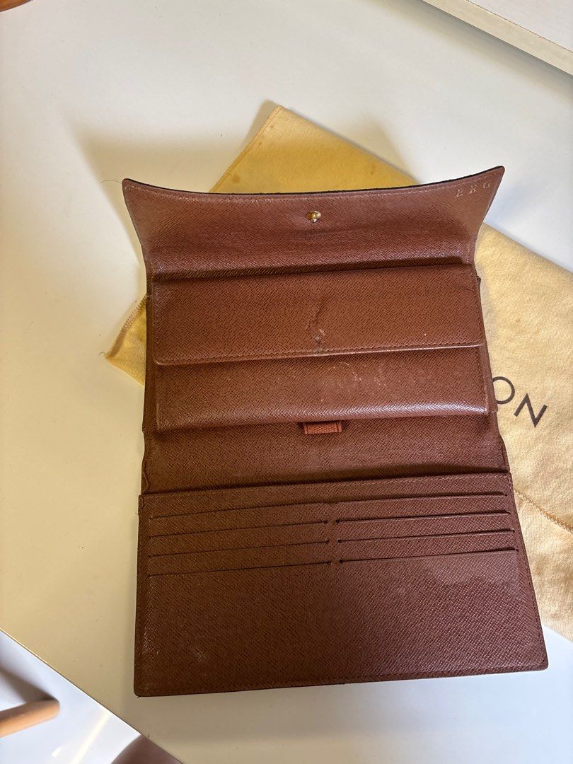 Louis Vuitton Sarah Long Wallet (Category: Luxury Bags & Wallets) located in Cabuyao City. Submitted by HelloSunshineDeclutters (Listing ID 1393102688, Image 2). Description: Guaranteed Authentic LVSarah Long Wallet Store Bought, but lost the receipt and box With dustbag only With hotstamp ERG Personal used No interior cracks Flaw: button Mark, edges are a bit worn, fading on card slot area With tolerable flaws, still in very much good usable con
