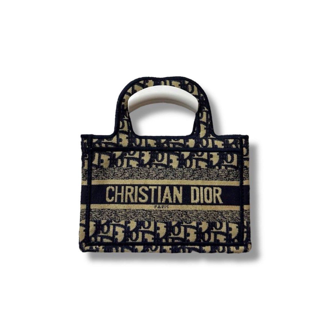 Mini Dior Book Tote Bag (Category: Luxury Bags & Wallets) located in Angeles City. Submitted by Miss_No_Limits_Ph (Listing ID 1393213347, Image 1). Description: Mini Dior Book Tote Bag 📌 Width: 9" Height: 6" Depth: 1.5" Handle: 10" Condition: 9/10 Issue: Missing Sling 🧷 Price: 1500 📍 Angeles City, Pampanga 🚛 Courier – J&T (Regular Shipping) .