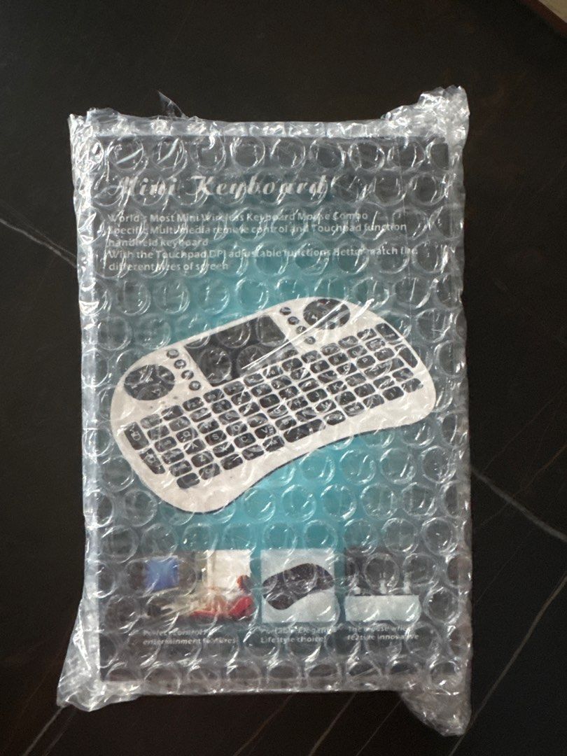 Mini Keyboard (Category: Computer Keyboard) located in Singapore. Submitted by w.t.p. (Listing ID 1393084607, Image 1). Description: - Mini keyboard with touchpad and mouse. - Perfect for remote control. - Brand new and sealed..