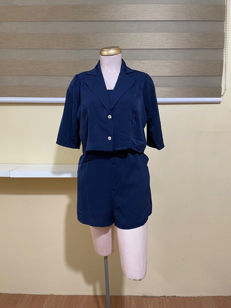 Navy Blue Romper with Polo/ Blazer (Category: Rompers) located in Manila. Submitted by vonerityy (Listing ID 1393226386, Image 1). Description: 2-in-1 romper set Mango Silk Small to Large Padded Adjustable strap Has zipper at the back Full smock at the back Waist tie Has pockets.