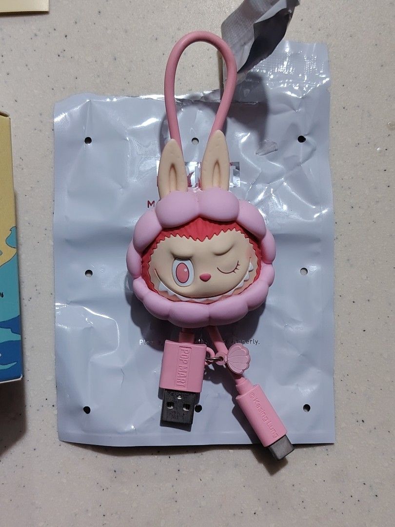 Pop Mart Drunk in Sea type C Cable pendant (Category: Designer & Blind Box Toys) located in Quezon City. Submitted by sureandlegit (Listing ID 1393093116, Image 2). Description: For sale 100 % Aunthentic Pop Mart item The Monsters Drunk in Sea Cable Pendant Shell design Comes complete with opened box bottom part, unsealed foil just to check if it is working then return to box. What you see what you get Pls be mindful before making an offer, be re
