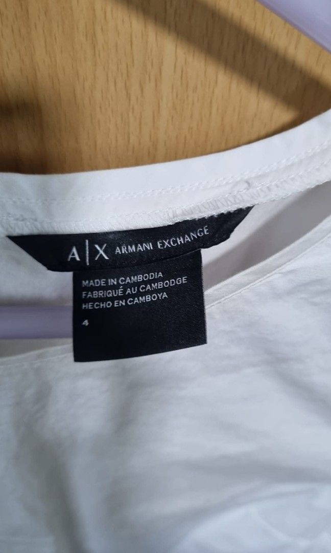 Armani White Dress (Category: Dresses) located in Makati City. Submitted by itemsforless2025 (Listing ID 1393266162, Image 3). Description: short white crisp dress great for sundays/ dinner above knee style, straight cut.