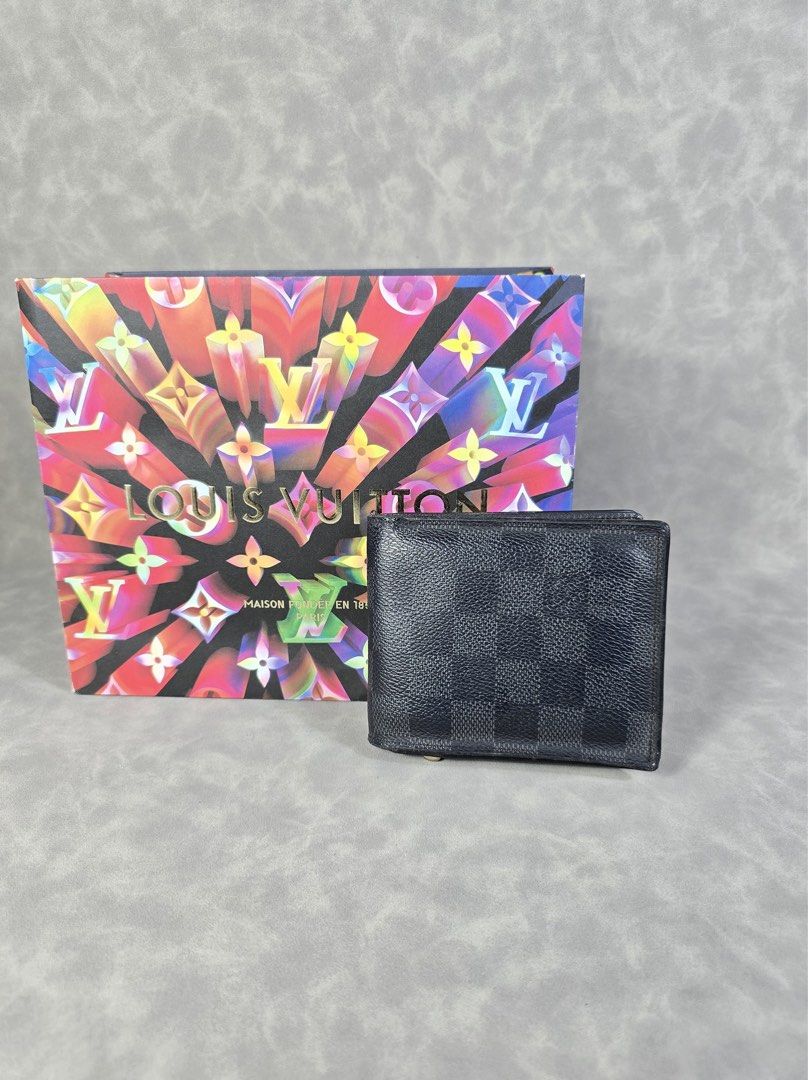 Authentic LV Graphite Bifold Wallet (Category: Luxury Bags & Wallets) located in Taguig. Submitted by luxchelry (Listing ID 1393261630, Image 1). Description: ♦️Comes with paperbag 🌟8.5/10 ♦️Any discoloration is due to lighting only. 🌟100% Authentic, Moneyback guarantee ✨️P7000✨️ Disclaimer: All product names, logos, brands and other trademarks or images shown mentioned are the property of the respective brand owners. These brand owners are not