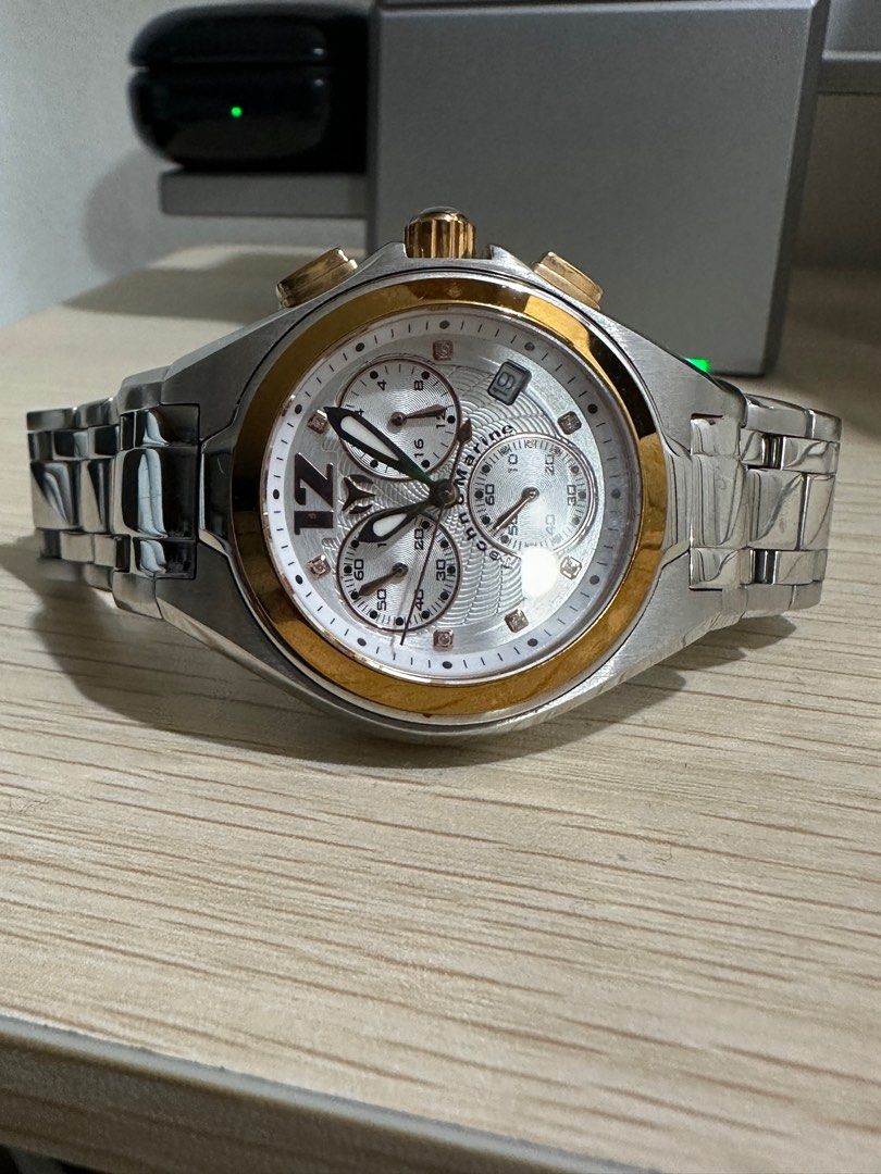 Authentic Technomarine Mantaray (Category: Luxury Watches) located in Malabon City. Submitted by vintagemom (Listing ID 1393339978, Image 2). Description: Stainless steel case with a two-tone (silver and gold-plated) stainless steel bracelet. Fixed gold-plated bezel. Silver dial with luminous gold-tone hands and crystal hour markers. An Arabic numeral appears at the 12 o’clock position. Minute markers around the outer rim. Dial Type: Analog. Lumi