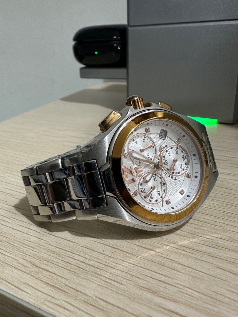 Authentic Technomarine Mantaray (Category: Luxury Watches) located in Malabon City. Submitted by vintagemom (Listing ID 1393339978, Image 3). Description: Stainless steel case with a two-tone (silver and gold-plated) stainless steel bracelet. Fixed gold-plated bezel. Silver dial with luminous gold-tone hands and crystal hour markers. An Arabic numeral appears at the 12 o’clock position. Minute markers around the outer rim. Dial Type: Analog. Lumi