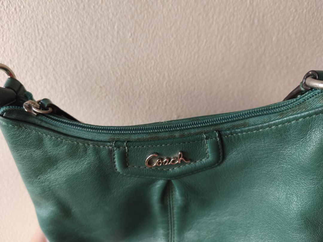 Coach Script Logo Ashley Green Crossbody Leather Bag (Category: Luxury Bags & Wallets) located in Cebu City. Submitted by declutterwithciara (Listing ID 1393338293, Image 3). Description: *price is negotiable* Authentic Coach Ashley Leather Bag Dimensions: H 6.5” x L 9” x W 2.5” Condition: Heavily used since it was my favorite bag for years (since 2018); very durable! Flaws: Lots of yellow stains inside (near the zipper area) and outside (zipper 