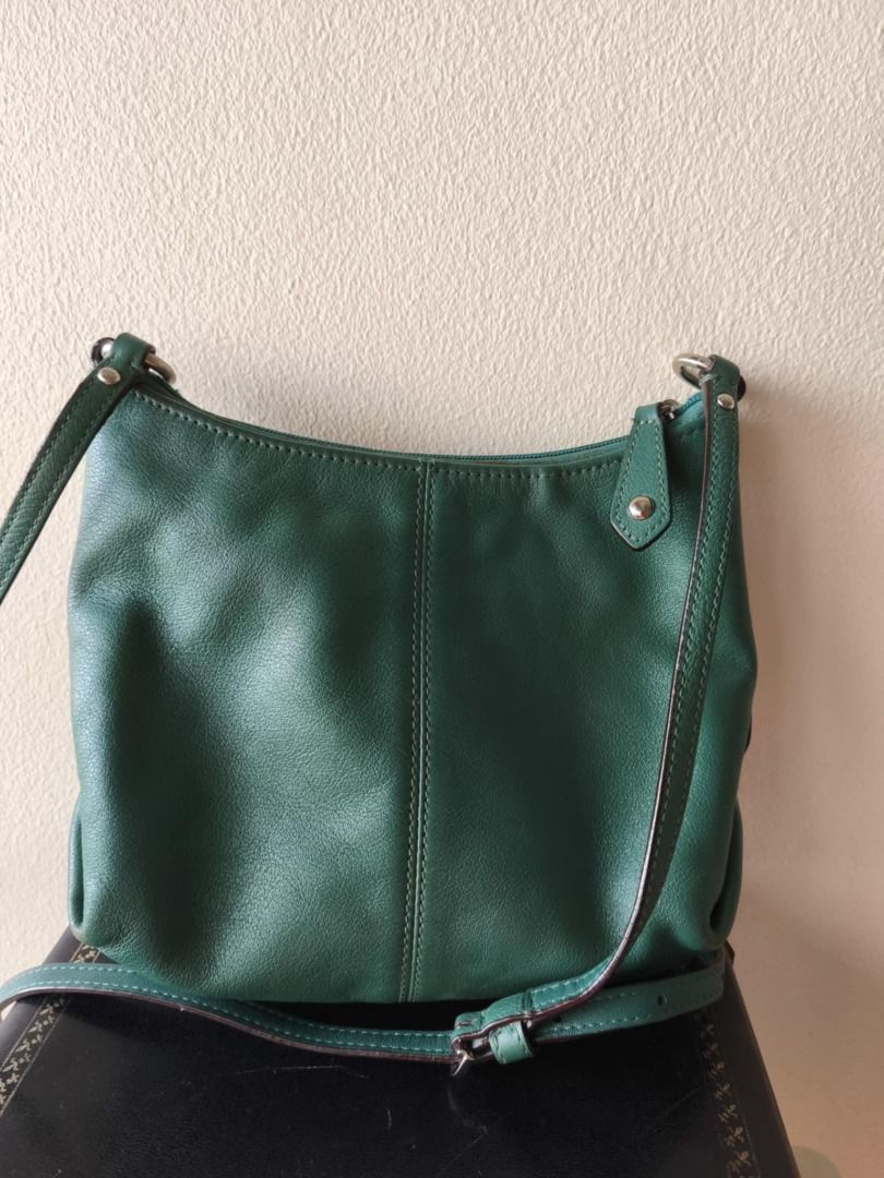 Coach Script Logo Ashley Green Crossbody Leather Bag (Category: Luxury Bags & Wallets) located in Cebu City. Submitted by declutterwithciara (Listing ID 1393338293, Image 2). Description: *price is negotiable* Authentic Coach Ashley Leather Bag Dimensions: H 6.5” x L 9” x W 2.5” Condition: Heavily used since it was my favorite bag for years (since 2018); very durable! Flaws: Lots of yellow stains inside (near the zipper area) and outside (zipper 