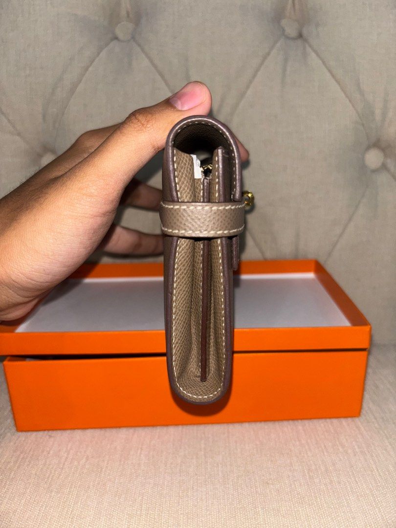 Hermes kelly etoupe long wallet (Category: Luxury Bags & Wallets) located in Quezon City. Submitted by icequizon (Listing ID 1393283172, Image 2). Description: 100% authentic Excellent condition Please check the photos for the exact condition Kelly Long wallet Slightly negotiable No strap .