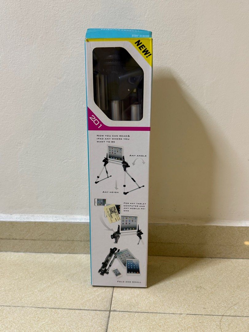 iPad stand (Category: Mounts & Holders) located in Singapore. Submitted by sekyr (Listing ID 1393369809, Image 2). Description: - Brand new tablet stand - Adjustable height and angle - Folds for compact storage .