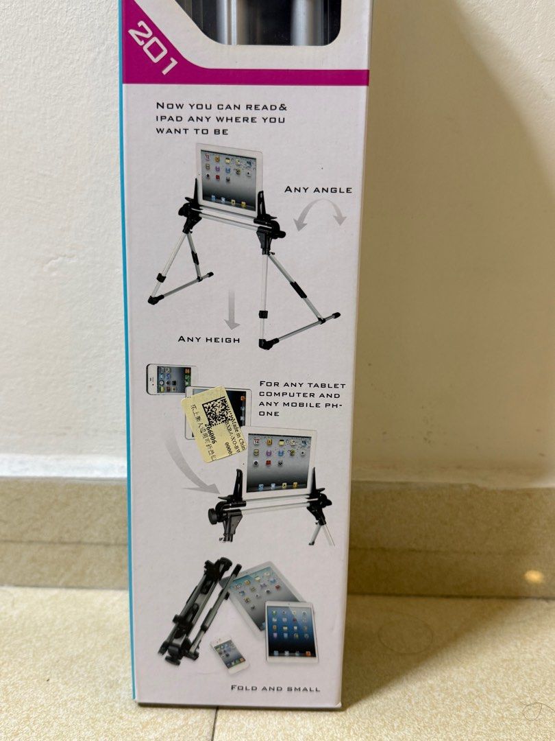 iPad stand (Category: Mounts & Holders) located in Singapore. Submitted by sekyr (Listing ID 1393369809, Image 3). Description: - Brand new tablet stand - Adjustable height and angle - Folds for compact storage .