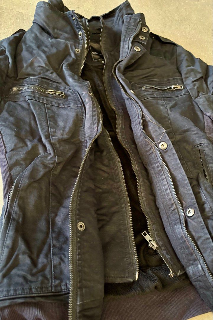Jacket (Category: Coats, Jackets and Outerwear) located in Singapore. Submitted by koris_box (Listing ID 1393319567, Image 5). Description: Visibly well worn. Wrinkled and creased due to keeping in storage. With fleeced lining except on the sleeves. 2 sets of zips, and 1 row of buttons. Top pockets are fake pockets. 2 working side pockets with zips. Bought in Taiwan, brand is Laking. Please note that this is a WELL WORN jacket. .