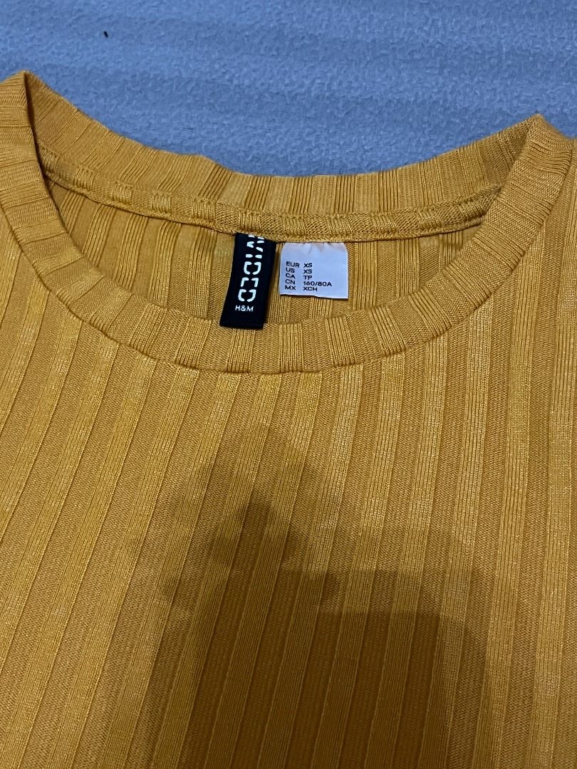 Mustard yellow 3/4 sleeve ribbed top (Category: Shirts) located in San Pedro. Submitted by 111vkk (Listing ID 1393294628, Image 2). Description: ↝ Description: Corpo vibes H&M mustard yellow 3/4 sleeve top, super nice ribbed details ↝ Size on tag: XS ↝ Fits: XS-S ↝ Issues: None ❣ All secondhand, pls manage your expectations! ❣ No ww pics but send a message for the measurements ❣ GCash/bank transfer only.