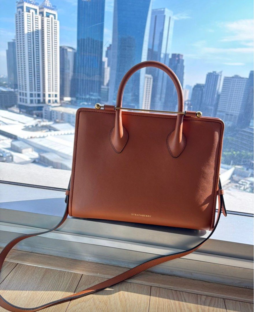 Strathberry bag (Category: Luxury Bags & Wallets) located in Mandaluyong City. Submitted by pam_1026 (Listing ID 1393411295, Image 1). Description: Strathberry midi tote bag in leather chestnut Selling for 45k brand new in Zalora Barely used , Bought in HK .