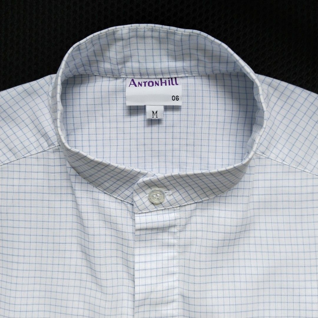AntonHill | Graph Check Short-sleeve Shirt (Category: Tshirts & Polo Shirts ) located in Batangas. Submitted by second_cycle (Listing ID 1393476627, Image 1). Description: •65% polyester, 35% cotton •white fabric w/ thin blue graph check pattern •17" shoulder width •21" shirt width •8" short sleeve length •27" from collar base to hem •Mandarin collar ✅ no rips or loose threads ✅ no stains; original buttons 🫧 washed and pressed before ship out 🔵