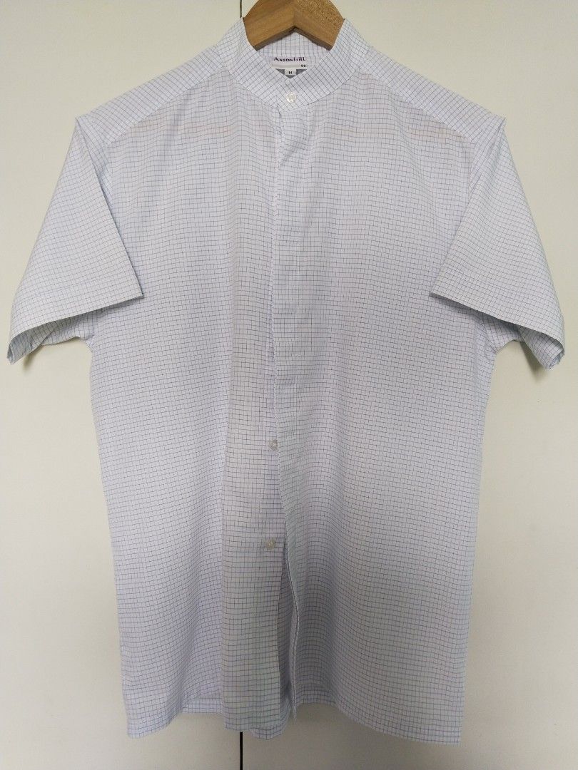 AntonHill | Graph Check Short-sleeve Shirt (Category: Tshirts & Polo Shirts ) located in Batangas. Submitted by second_cycle (Listing ID 1393476627, Image 3). Description: •65% polyester, 35% cotton •white fabric w/ thin blue graph check pattern •17" shoulder width •21" shirt width •8" short sleeve length •27" from collar base to hem •Mandarin collar ✅ no rips or loose threads ✅ no stains; original buttons 🫧 washed and pressed before ship out 🔵
