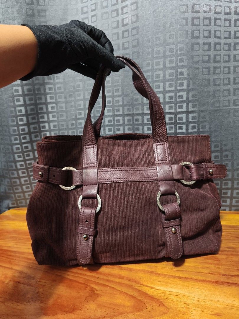 Charriol suede leather handbag (Category: Luxury Bags & Wallets) located in Baguio. Submitted by queenlyne_vintage_rare_finds (Listing ID 1393480805, Image 1). Description: Elegant Charriol tote bag in a rich burgundy corduroy. Features leather accents, silver-tone hardware, and double handles. The interior is lined with a matching fabric and includes a zippered pocket. The bag has a structured shape with decorative straps and rings. Measurements