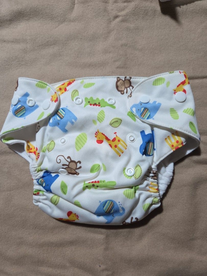 Lovable Lampin Cloth Diaper - Small to Medium (Category: Diapers & Baby Wipes) located in Quezon City. Submitted by klarebear15 (Listing ID 1393471102, Image 1). Description: - Lovable Lampin cloth diaper with fun animal print. - Features snap closures for easy adjustment. - Designed for small to medium-sized babies. - Made in China..