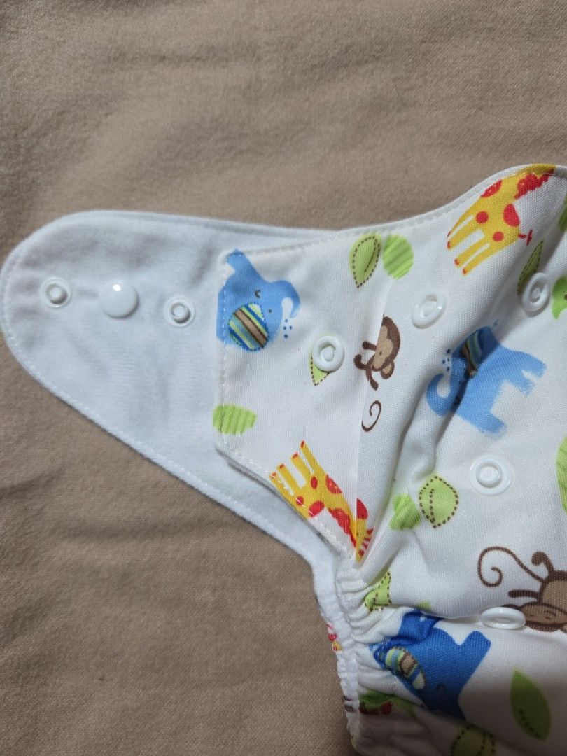 Lovable Lampin Cloth Diaper - Small to Medium (Category: Diapers & Baby Wipes) located in Quezon City. Submitted by klarebear15 (Listing ID 1393471102, Image 3). Description: - Lovable Lampin cloth diaper with fun animal print. - Features snap closures for easy adjustment. - Designed for small to medium-sized babies. - Made in China..